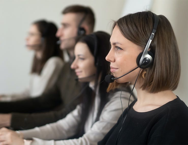 Customer services employees sitting at desks