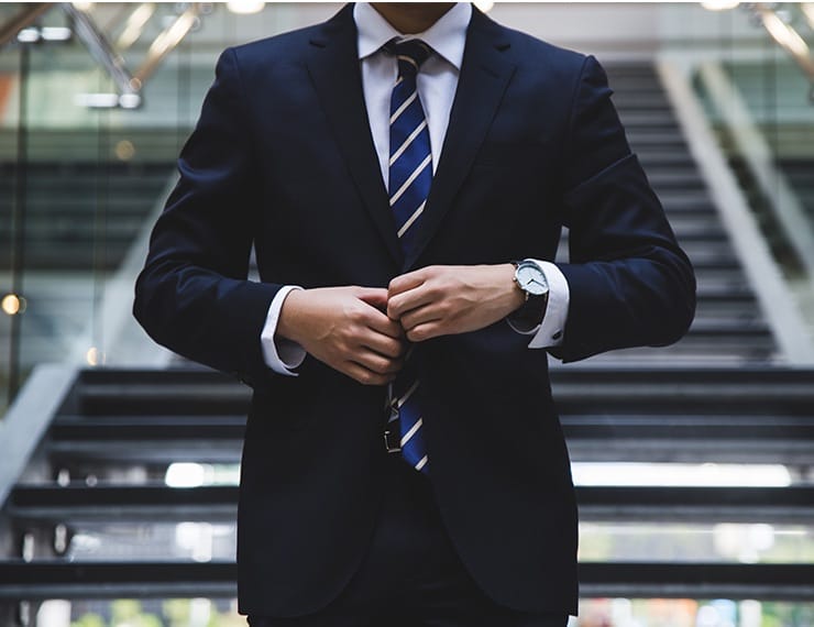 Legal advisor buttoning up blazer