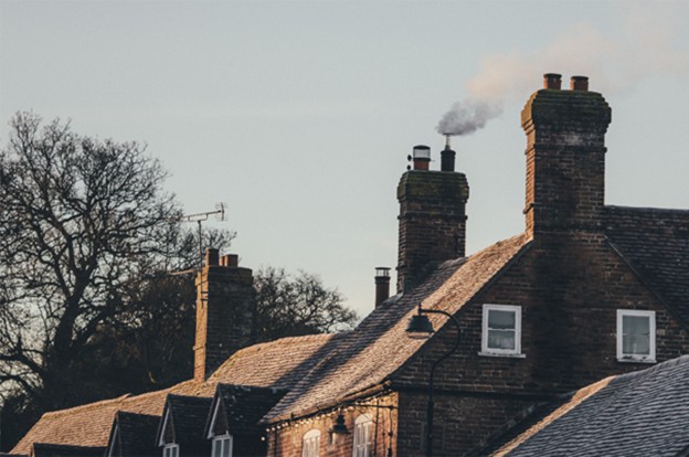 Row of houses with smoking chimneys