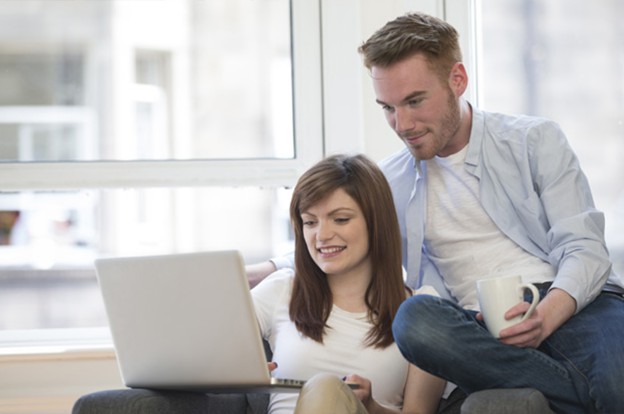 Couple looking at laptop