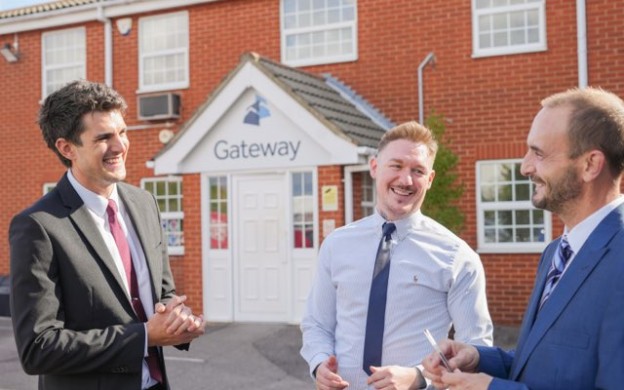 Gateway employees talking outside office