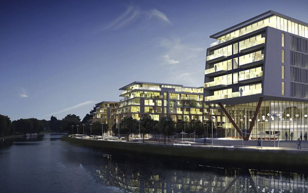 Archictectural buildings alongside river bank