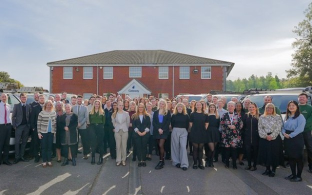 Gateway employees standing outside main office