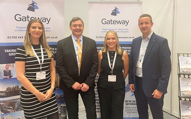 Gateway employees standing in front exhibition stand