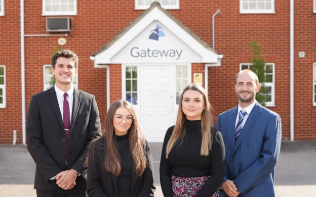 Gateway employees standing outside main office